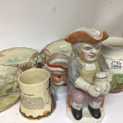 A 19th century ceramic Toby jug a Crown Devon musical jug and six Royal Doulton plates depicting hunting scenes and other ceramics.