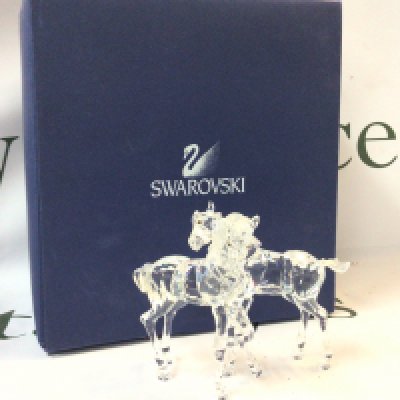 A boxed Swarovski horse crystal glass figure group. No obvious damage or restoration Postage category B