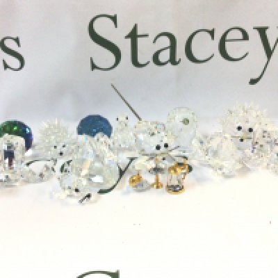 A collection of unboxed Swarovski Crystal glass figures including Snakes, baby seal, hedgehog, squirrel etc. Also including a Swarovski pen and cleaning kit. This lot cannot be posted