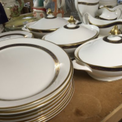 An extensive Quality Porcelain dinner and tea set decorated in Harlow pattern Royal Doulton a modern design with a Royal blue and gilt banding on a white ground first quality and no obvious damage.