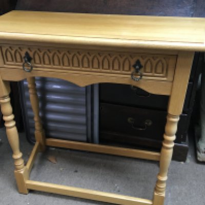 A light oak side table with single drawer on turned legs united with under stretch. NO RESERVE