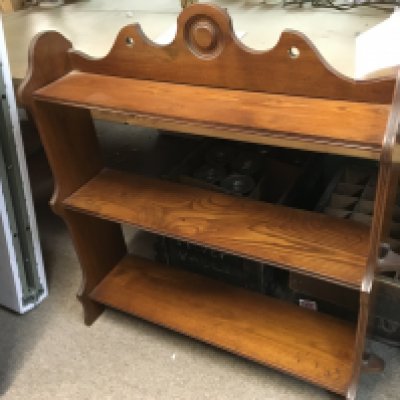 A three tier mahogany bookcase , 72cm tall 63cm wide.