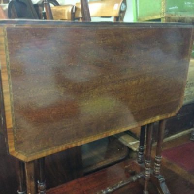 A collection of furniture comprising Edwardian mahogany twin flap table Open arm chair barometer and oak mirror plant stand .
