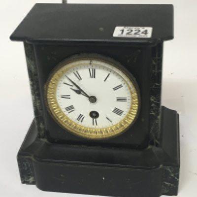 A Victorian black slate and marble mantle clock.