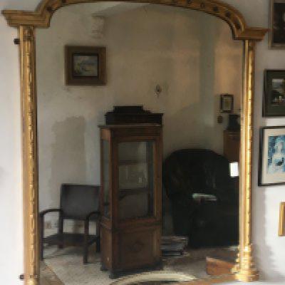 A large 19th century gilt wood wall mirror with an arched top132cm high width 122cm