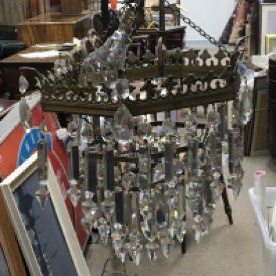 A pair of early 20th century hanging chandelier with graduating tiers of cut glass drops they appear to be complete. Diameter 28cm.