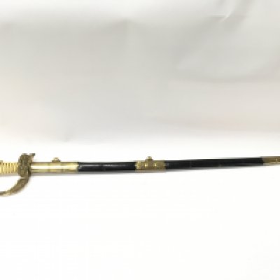 A 20th century naval officers dress sword with a brass hilt, lion head pommel , sword knot, unmarked blade. 90cm Approx total length. Blade 78cm. This lot cannot be posted