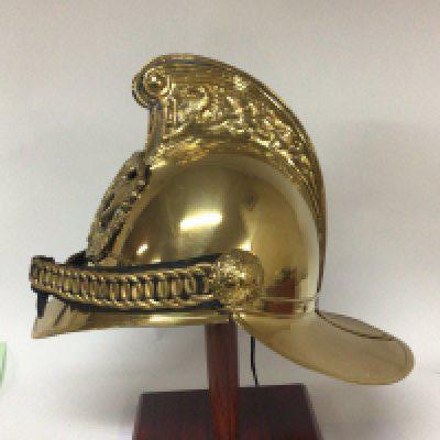 A replica Victorian brass fireman&rsquo;s helmet