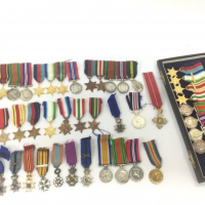 A collection of miniature war medals including Belgian and British medals. Postage category B