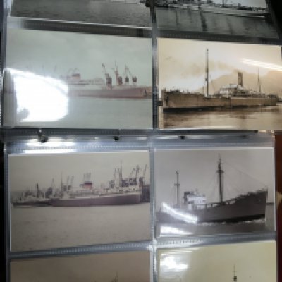 A box containing postcard albums including an interesting album of postcards social History of the 1980s Hippy Peace Convoy Sports The minors strike and many other albums including shipping and some Aviation. NO RESERVE