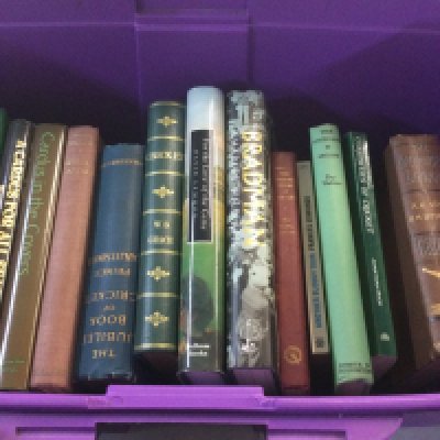 A box containing cricket books various.