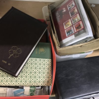 Three small boxes of World and U.K. stamps including presentation packs