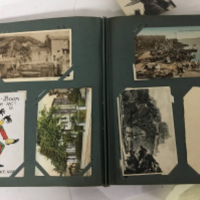 An album containing a good selection of late 19th and early 20th century postcards including Military cards. and others.