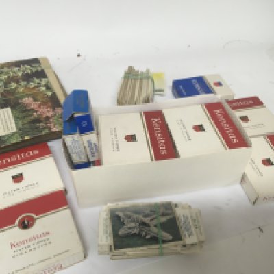 A collection of mixed cigarette cards and tea cards.