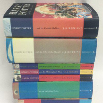 A collection of Harry Potter books including four first editions. Postage category C