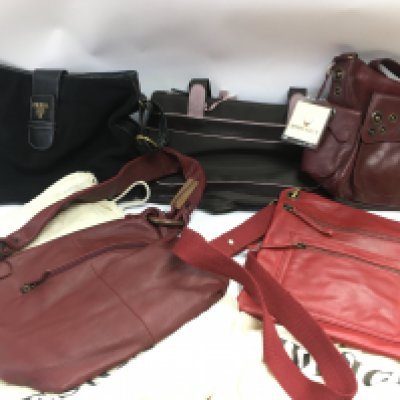 a collection of handbags including Hidesign, Radley and Prada. Postage category C