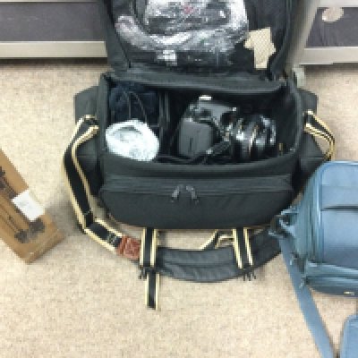 A Canon EOS 500D digital SLR, with a 300mm ultrasonic Canon lens and accessories. Postage category C