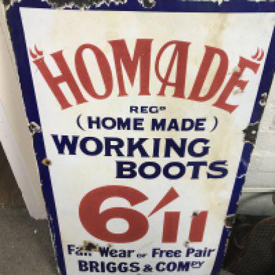 A vintage homade working boots enamel sign, Briggs & Compy. Dimensions 76x46cm. Postage category c