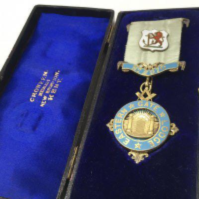 A cased sterling silver lodge medal. Postage category B