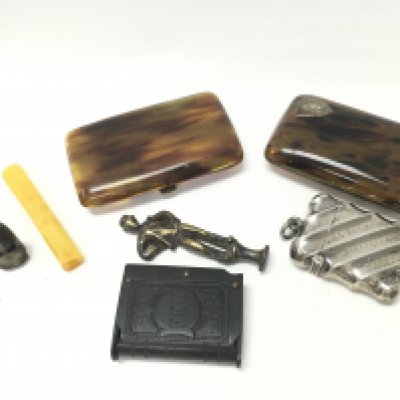 Smoking items including a silver hallmarked vesta case, a Vulcanite vesta case, tortoiseshell cigarette cases etc. Postage category B