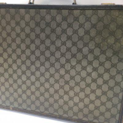 A Gucci 66 pattern canvas briefcase case with key .