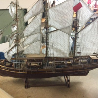 Three model sailing boats .