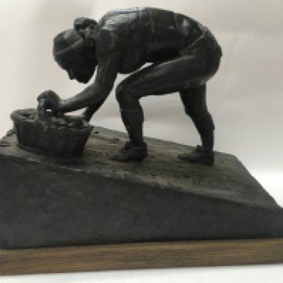 WITHDRAWN - A bronze figure the Harvest sculptor by Archie Forrest on an oak plinth base . 28 cm .