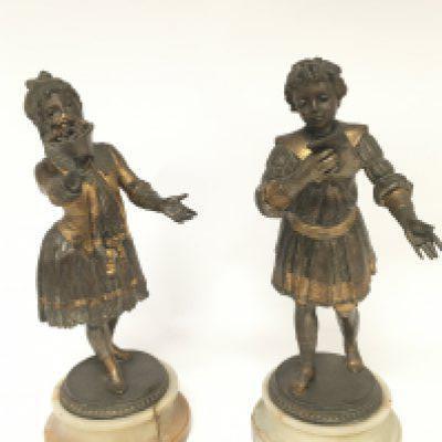 A pair of gilded and partially silvered late Victorian figures of onyx bases height 29cm