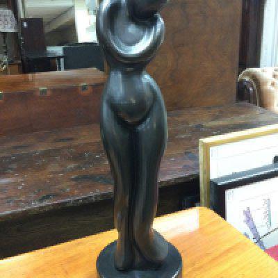 A limited edition modern bronze of a female form on a circular marble base indistinctly signed , 62cm tall. This lot cannot be posted