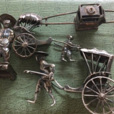 A collection of four Chinese silver figures and a cased set of spoons,