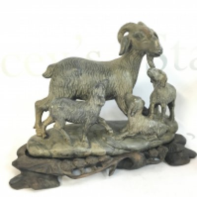 A Chinese soapstone goat figure with a wooden base , 18cm tall. This lot cannot be posted. NO RESERVE