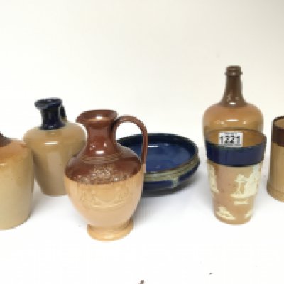 A collection of Royaland Lambeth Doulton stoneware ceramics bottle vases including a copy of the Salisbury jug a blue glazed dish and a beaker and others no obvious damage. NO RESERVE