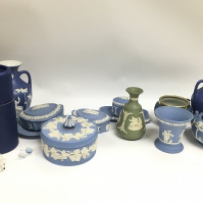 A Collection of Wedgwood containers and vases and two small boxed Swarovski Crystal animals including a hedgehog and a cat. This lot cannot be posted