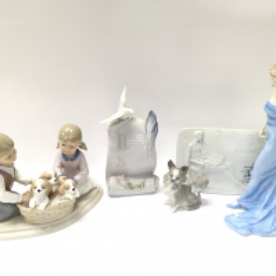 A Collection of porcelain figures including Royal Doulton Diana figure, Lladro dog figure, Leonardo collection figure group, Lladro society scroll and plaque. Some boxed. This lot cannot be posted