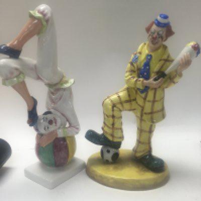 Two clown figures Doulton and Coalport.