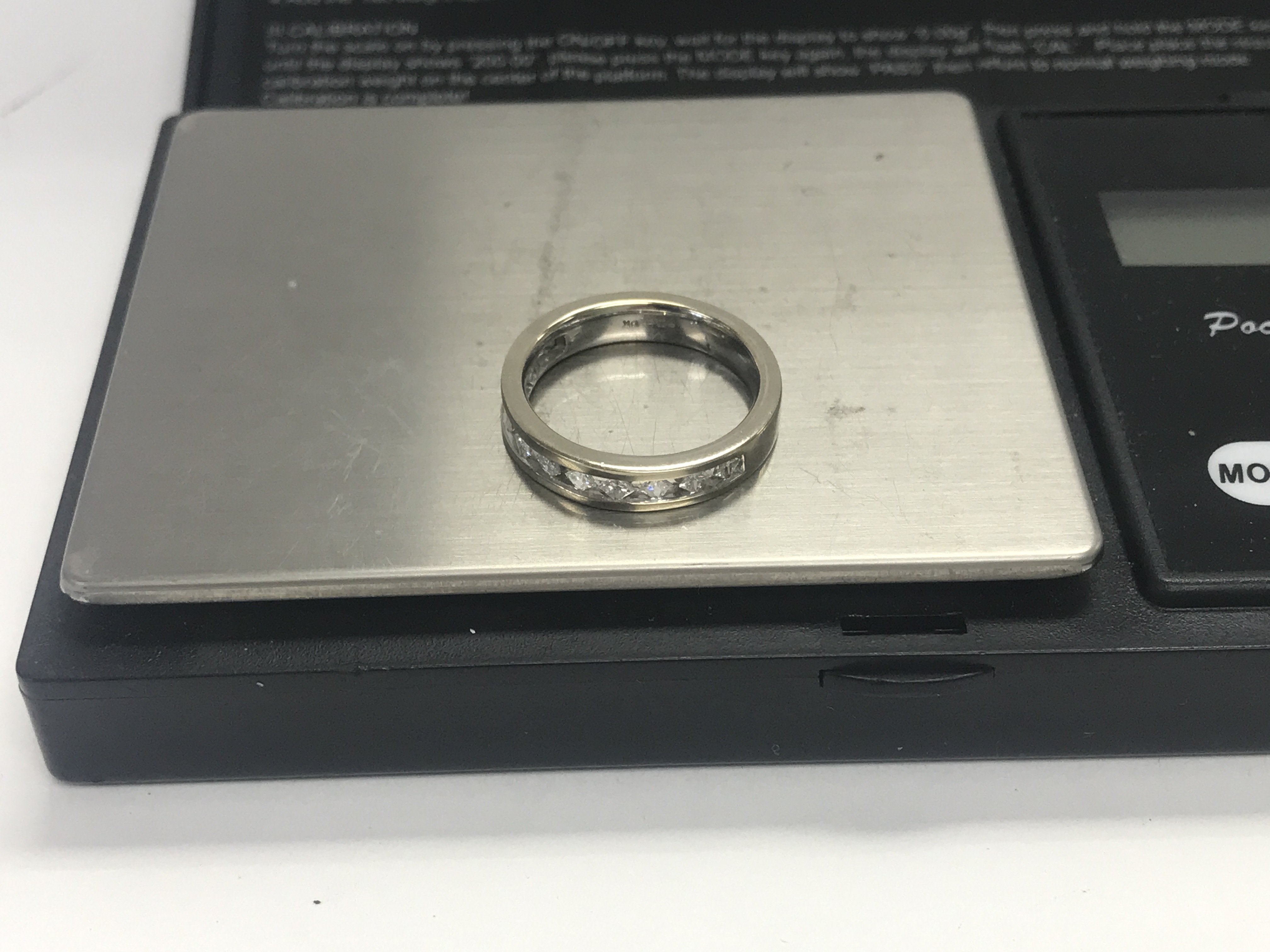 A 9ct white gold diamond half eternity ring. 25pts, 4.5 grams, size O.