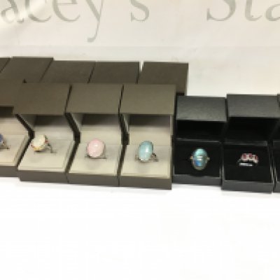 A collection of 8 assorted silver rings set with various stones. Postage B
