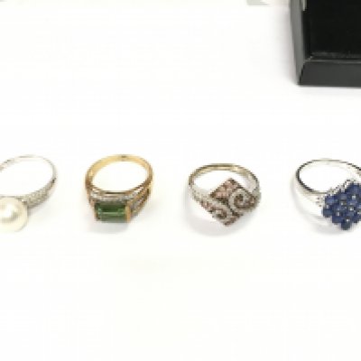 Collection of four 9ct gold rings set with various stones. 17.62g