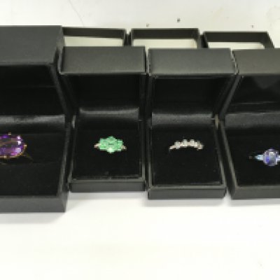 A collection of four 9ct gold rings set with various stones. 12.43g total Postage B