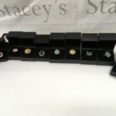 A collection of 10 assorted silver rings set with various stones. Postage B