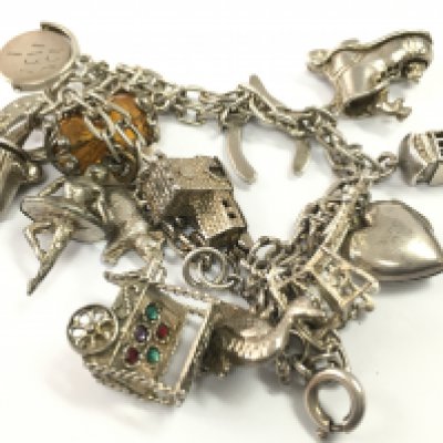 A silver charm bracelet, postage category A