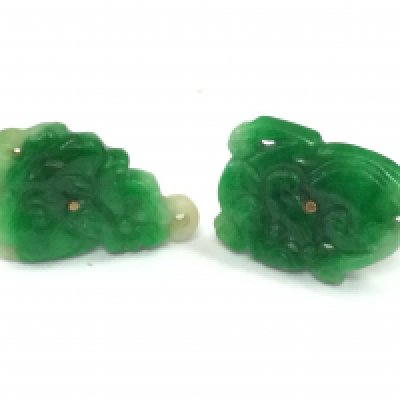 A pair of 9ct gold mounted jade studs . 3.6g total weight. Postage category A