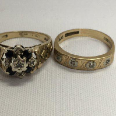Two 9 ct gold rings inset with gem stone inset . Total weight 5.4 grams.