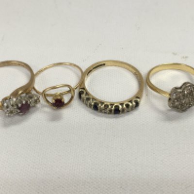 Four 9 ct gold rings with gem stone inset . 6 gram total weight.