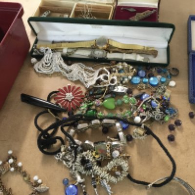 A collection of costume jewellery dress watches and a small collection of coins .