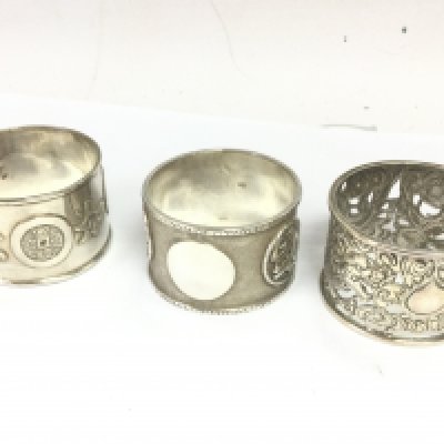 Three Chinese silver napkin rings . Postage category A