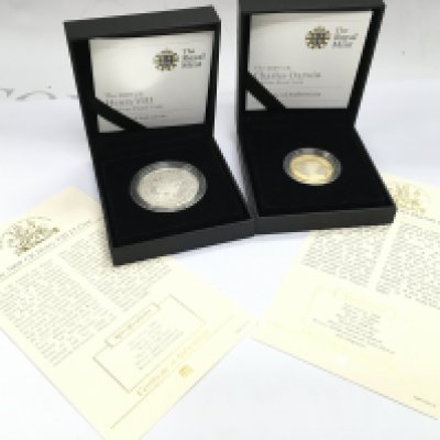 Cased Royal Mint Henry VII 2009 and Charles Darwin silver proof coins. Postage cat A