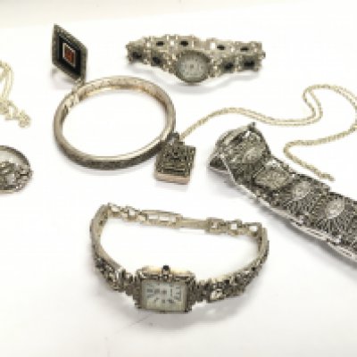 A mixed collection of silver and marcasite jewellery including bracelets, necklaces , ring etc . Postage category a