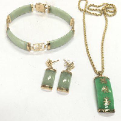A collection of 9ct gold and jade jewellery including a Chinese bracelet, earrings , necklace with pendant. Postage category A