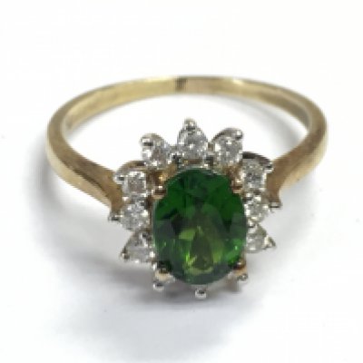 A 9 carat gold green cubic zirconia ring , size P, 2.7g postage category A